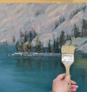 brush varnish down the painting