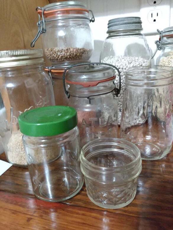 Empty jars for cleaning oil paint brushes